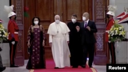 Iraqi President Barham Salih, his wife Sarbagh Salih, and Pope Francis attend a welcoming ceremony at the Presidential Palace during the Pope's historic tour in Baghdad, Iraq, March 5, 2021, in this screen grab taken from video. (Iraqiya TV/Reuters TV)