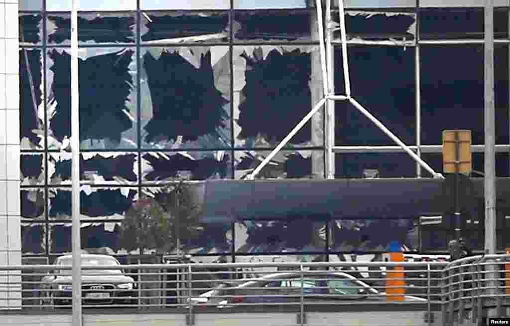 Broken windows seen at the scene of explosions at Zaventem, March 22, 2016.