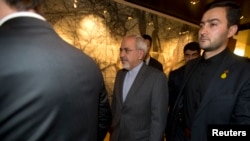 Iranian Foreign Minister Mohammad Javad Zari, center, departs meeting with EU foreign ministers, Iran Nuclear talks, Geneva, Nov. 9, 2013.