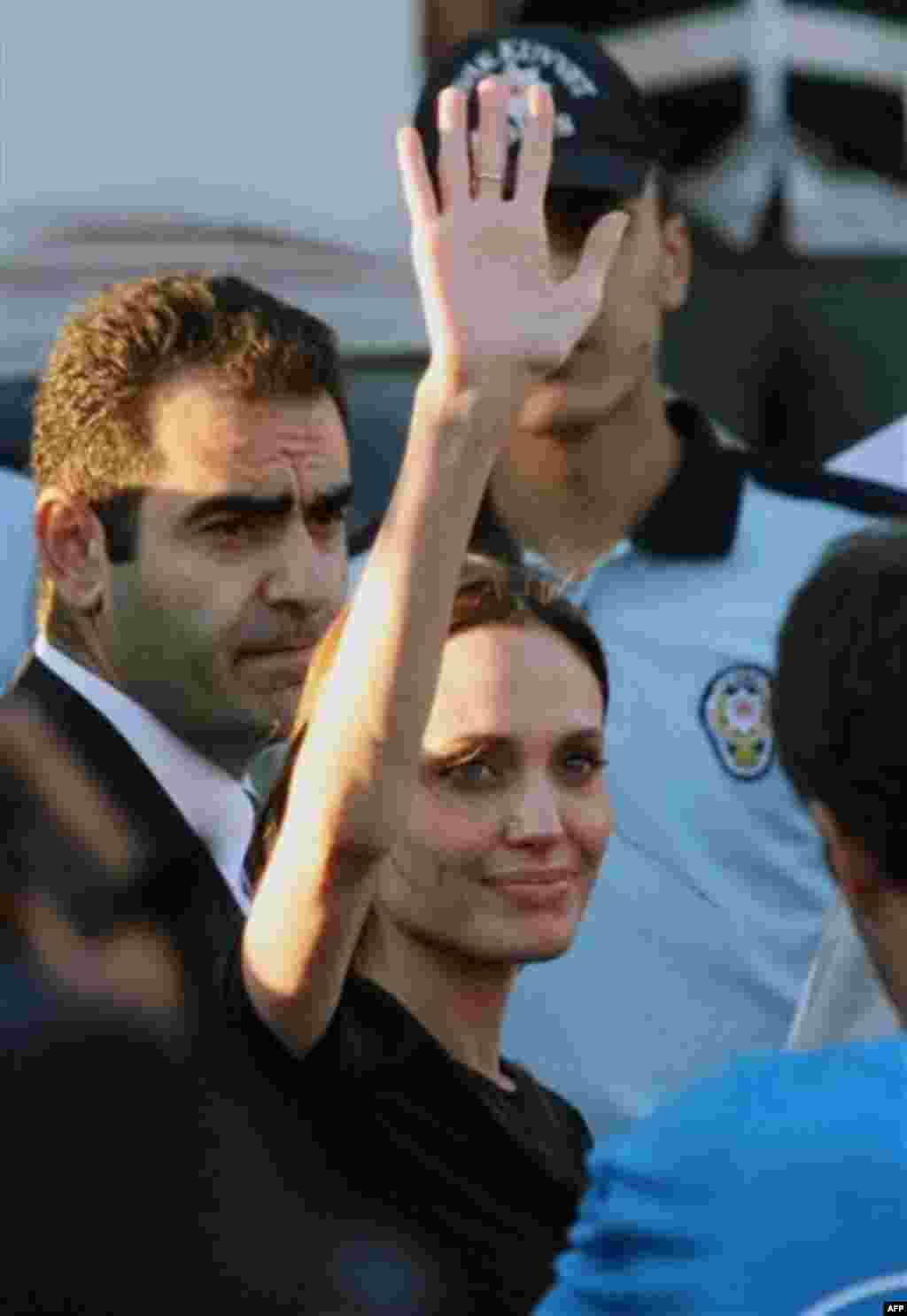 Angelina Jolie, the US actress and goodwill ambassador for the U.N. High Commissioner for Refugees, waves after her visit to a Syrian refugee camp in Turkish town of Altinozu in Hatay province, Turkey, Friday, June 17, 2011. Jolie traveled to Turkey's bo