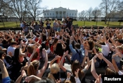 Students who walked out of their Montgomery County, Maryland, schools protest against gun violence in front of the White House in Washington, Feb. 21, 2018.