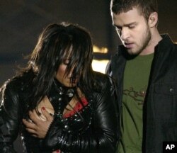 FILE - Entertainer Janet Jackson, left, covers her breast after her outfit came undone during the half-time performance with Justin Timberlake at Super Bowl XXXVIII in Houston, Feb. 1, 2004.