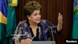 FILE - Brazil's President Dilma Rousseff speaks during a meeting with leaders of the Allied Base of parties in the Senate and House of Representatives at the Planalto Palace in Brasilia.
