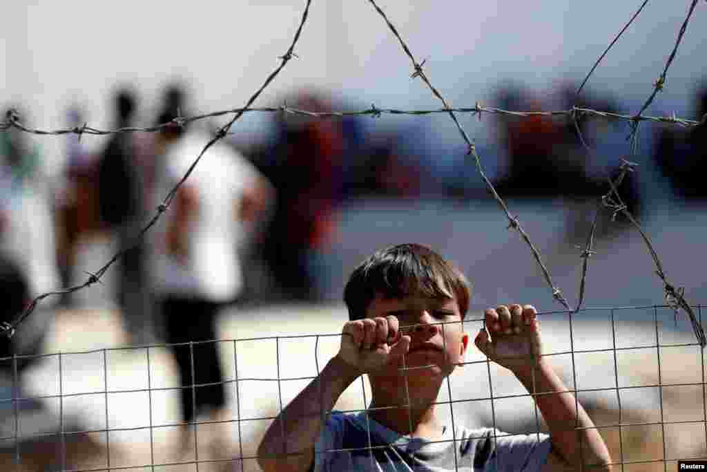 A child is seen at the new temporary camp for migrants and refugees, on the island of Lesbos, Greece.