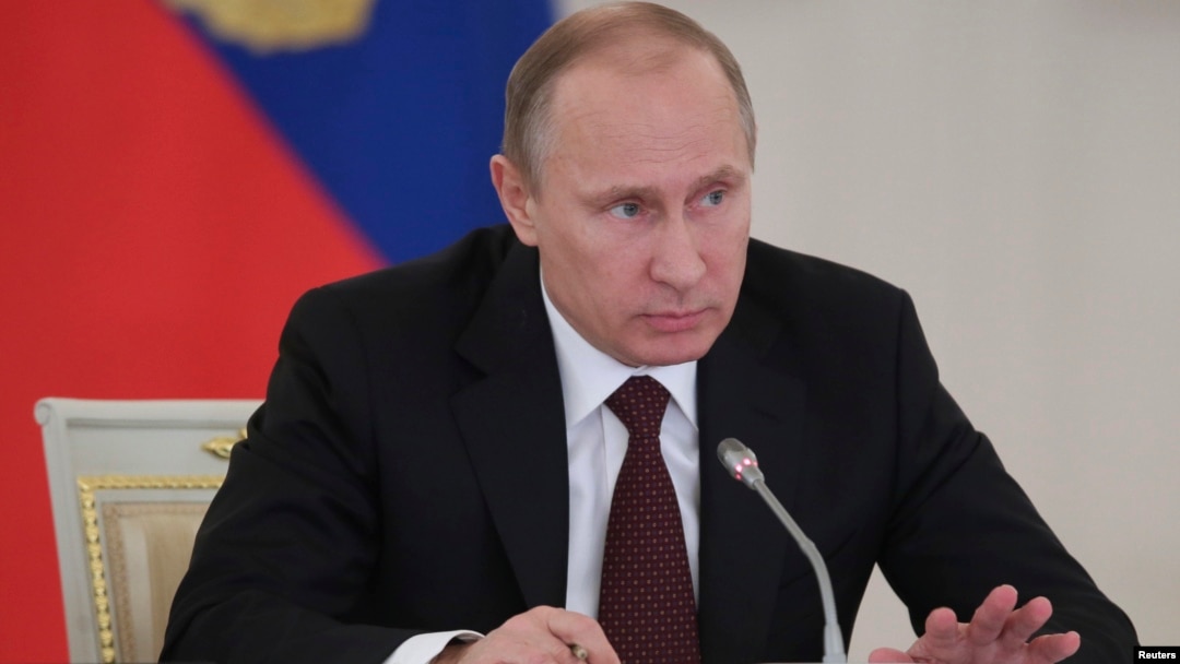 Russian President Vladimir Putin takes part in a meeting on social and economic development in Moscow's Kremlin, Dec. 23, 2013.