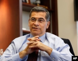 FILE - California Attorney General Xavier Becerra discusses various issues during an interview with The Associated Press, in Sacramento, California, Oct. 10, 2018.