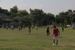 The massive soccer field hosts up to three soccer sessions per day at Seametrey Children's Village. In this picture is a friendly match played by the school students and foreign volunteers, on Sept. 24, 2019. (Rithy Odom/VOA Khmer)