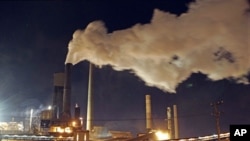 Smoke bellows from a chimney stack at BlueScope Steel's steelworks at Port Kembla, south of Sydney, Australia, 1 Jul, 2012.