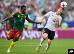Germany's Timo Werner heads the ball past Cameroon's Ernest Mabouka during the Confederations Cup, Group B soccer match at the Fisht Stadium in Sochi, Russia, June 25, 2017.