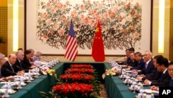 U.S. Commerce Secretary Wilbur Ross, second from left, and Chinese Vice Premier Liu He, fourth right, attend a meeting at the Diaoyutai State Guesthouse in Beijing, Sunday, June 3, 2018.