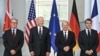 (L-R) British Prime Minister Keir Starmer, US President Joe Biden, German Chancellor Olaf Scholz and French President Emmanuel Macron pose for a family photo at the start of their "Quad meeting" at the Chancellery in Berlin, on October 18, 2024.