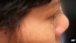 In this photo taken on Tuesday, Aug. 16, 2011, Cambodian maid Hok Pov, 31, cries as she speaks during an interview in Petaling Jaya, near Kuala Lumpur, Malaysia. Hok Pov may be poor but she had never been beaten or gone hungry until she came to work in Ma