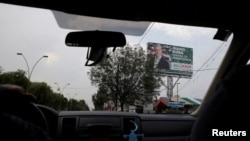 FILE - A billboard with the picture of Alfredo del Mazo of Institutional Revolutionary Party (PRI), candidate for governor of the State of Mexico, is seen in Metepec, State of Mexico, Mexico, May 16, 2017.