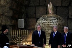 Israeli Prime Minister Benjamin Netanyahu, center, U.S. Secretary of State Mike Pompeo, left, and U.S. Ambassador to Israel David Friedman visit the Western Wall Tunnels in Jerusalem's Old City, March 21, 2019.