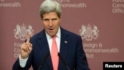 U.S. Secretary of State John Kerry gestures during his joint news conference with Britain's Foreign Secretary William Hague (not pictured) at the Foreign and Commonwealth Office in London September 9, 2013.