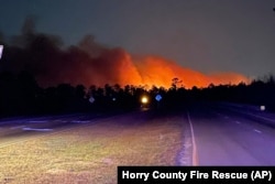 In this photo released by the Horry County Fire Rescue, smoke is seen from fires in Horry County, South Carolina, March 1, 2025.