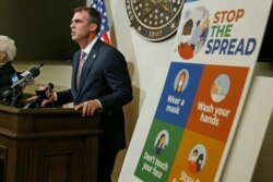 FILE - Oklahoma Gov. Kevin Stitt speaks during a news conference in Oklahoma City, July 9, 2020.