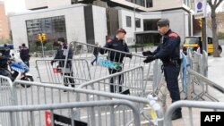Catalan regional police 'Mossos D'Esquadra' officers stand guard in front of the Sofia hotel near the Camp Nou stadium in Barcelona on Dec. 18, 2019, ahead of the Spanish League football match between Barcelona FC and Real Madrid CF. 
