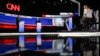 CNN journalists Jake Tapper and Dana Bash (R) moderate the first presidential debate of the 2024 elections between US President Joe Biden and former US President and Republican presidential candidate Donald Trump at the CNN's studios in Atlanta, Georgia, 