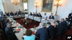 Austrian Chancellor Christian Kern (C) opens a meeting with his German and West Balkans counterparts on strategies to deal with Europe's migrant crisis, in Vienna, Austria, Sept. 24, 2016.