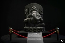 FILE - A statue of Hindu god Ganesha is displayed during an exhibition showing Indonesian historical artifacts repatriated from the Netherlands, at the National Museum in Jakarta, Indonesia, on Jan. 8, 2025.