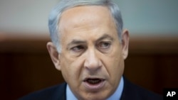 Israeli Prime Minister Benjamin Netanyahu attends the weekly cabinet meeting at his office in Jerusalem, Nov. 24, 2013. 