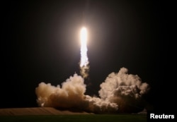 FILE -- A SpaceX Falcon Heavy rocket, carrying the U.S. Air Force's Space Test Program-2 mission, lifts off from the Kennedy Space Center in Cape Canaveral, Florida, U.S., June 25, 2019.