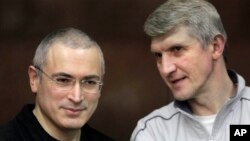 Mikhail Khodorkovsky, left, and his co-defendant Platon Lebedev, (File photo).