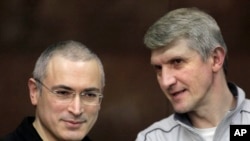 FILE - Mikhail Khodorkovsky, left, and co-defendant Platon Lebedev.