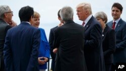 President Donald Trump poses for photos with G-7 leaders at the Ancient Greek Theater of Taormina during the G-7 Summit, May 26, 2017, in Taormina, Italy. 