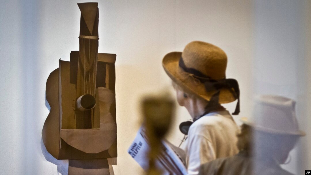 Pablo Picasso’s sheet metal and wire "Guitar" from 1914, is one of 140 sculptures from his entire career is shown during the Museum of Modern Art (MoMA) press preview, Sept. 9, 2015, in New York. 