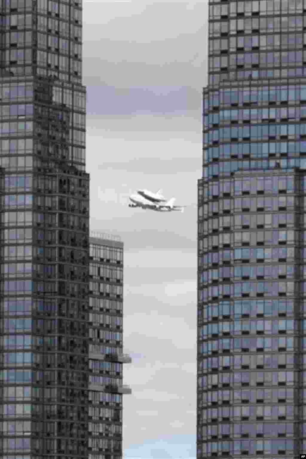 Space shuttle�Enterprise, riding on the back of the NASA 747 Shuttle Carrier Aircraft, cruises over the Hudson river, Friday, April 27, 2012 in New York. Enterprise is eventually going to make its new home in New York City at the Intrepid Sea, Air and Sp