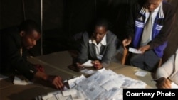 FILE: Polling officers counting ballots in a previous Zimbabwe election.