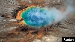 Yellowstone National Park’s Grand Prismatic hot spring is pictured in this undated handout photo obtained by Reuters, April 23, 2015. 