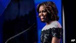 FILE - U.S. first lady Michelle Obama speaks in Washington D.C., March 14, 2014. 