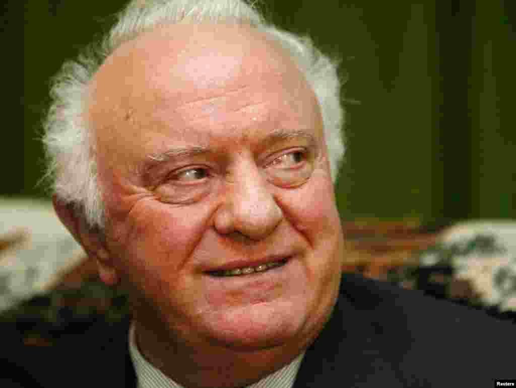 Former Georgian President Eduard Shevardnadze smiles during an interview with Reuters in his residence in Tbilisi, Nov. 24, 2003.