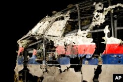 The reconstructed cockpit of Malaysia Airlines Flight 17 plane is seen prior to the Dutch Safety Board presenting its final report into what caused the plane to break up over eastern Ukraine, in Gilze-Rijen, the Netherlands, Oct. 13, 2015.