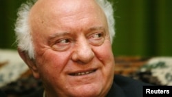 Former Georgian President Eduard Shevardnadze smiles during an interview with Reuters in his residence in Tbilisi, Nov. 24, 2003.