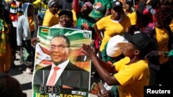 Supporters of President Emmerson Mnangagwa's ZANU PF party gather to march for non-violent, free and fair general elections in Harare, Zimbabwe, June 6, 2018.