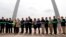 Susan Saarinen, daughter of Gateway Arch architect Eero Saarinen, cuts the ribbon dedicating the renovation of the Gateway Arch National Park, July 3, 2018, in St. Louis. The $380 million project has transformed the entrance to the Arch as well as its museum and the grounds surrounding the monument.