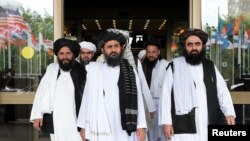 FILE - Members of a Taliban delegation leave after peace talks with Afghan senior politicians in Moscow, May 30, 2019.