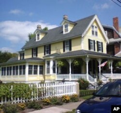 This is a small, but quaint Cape May Victorian home. Note the ruffled gingerbread trim.