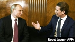 AUSTRIA -- Austrian Chancellor Sebastian Kurz (R) welcomes Russian President Vladimir Putin during a one-day visit in Vienna,June 5, 2018