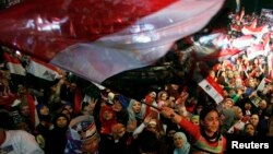 FILE - Supporters of Egypt's army and police gather at Tahrir square in Cairo, on the third anniversary of Egypt's uprising, Jan. 25, 2014. The government, wary of new protests, has tightened security in Cairo.