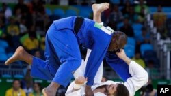 File: In this representative illustration, France's Cyrille Maret, white, competes against Mali's Ayouba Traore during the men's 100-kg judo competition at at the 2016 Summer Olympics in Rio de Janeiro, Brazil, Thursday, Aug. 11, 2016.