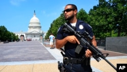 Capitol Hill Police officer Nathan Rainey stands guard on Capitol Hill in Washington, after House Majority Whip Steve Scalise of Louisiana was shot during a congressional baseball practice in Alexandria, Va., June 14, 2017.