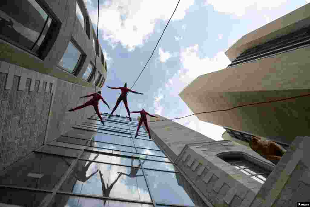 Members of the Mystorin Theatre Group perform acrobatics during their "Graffiti" show in Jerusalem.