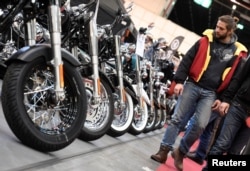 FILE - Harley-Davidson bikes are lined up at a bike fair in Hamburg, Germany, Feb. 24, 2017.