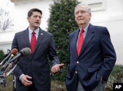 FILE - House Speaker Paul Ryan of Wisconsin, right, and Senate Majority Leader Mitch McConnell of Kentucky meet with reporters outside the White House in Washington after meeting with President Donald Trump.