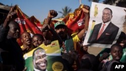 Supporters of the newly elected Zimbabwe President Emmerson Mnangagwa celebrate in Mbare, Harare, Aug. 3, 2018. 